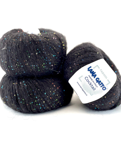 Three skeins of dark yarn with a label on a white background