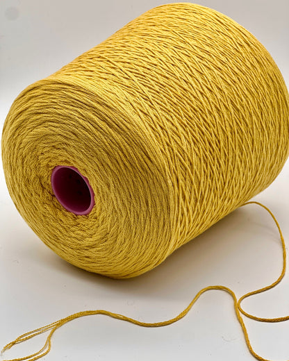 Yellow spool of yarn on a white background