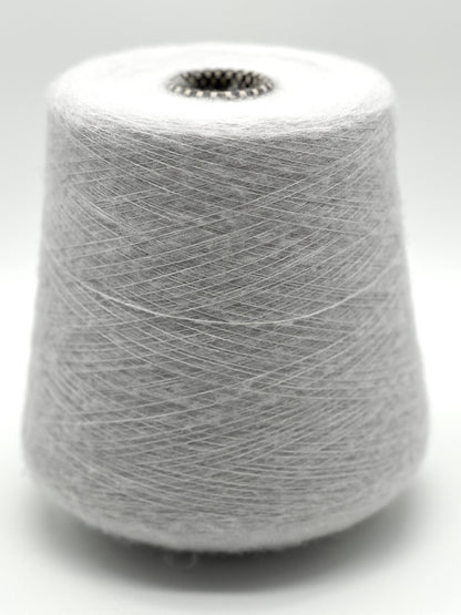Spool of gray yarn on a white background