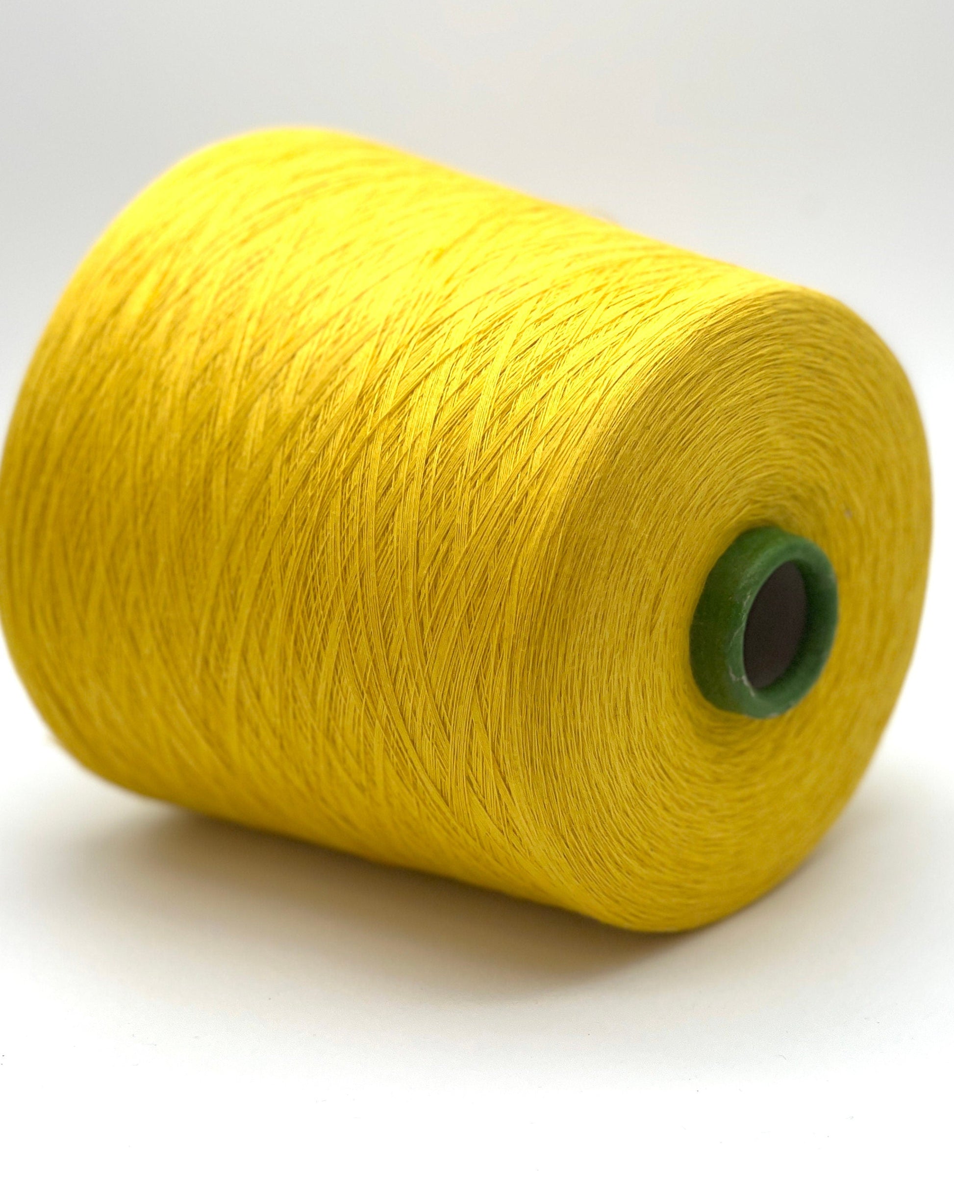 YUMA by Prisma Ricerche — sunflower yellow ecological lace-weight cable cotton yarn, shown on cone and in texture close-ups, available at iDOKNiT.