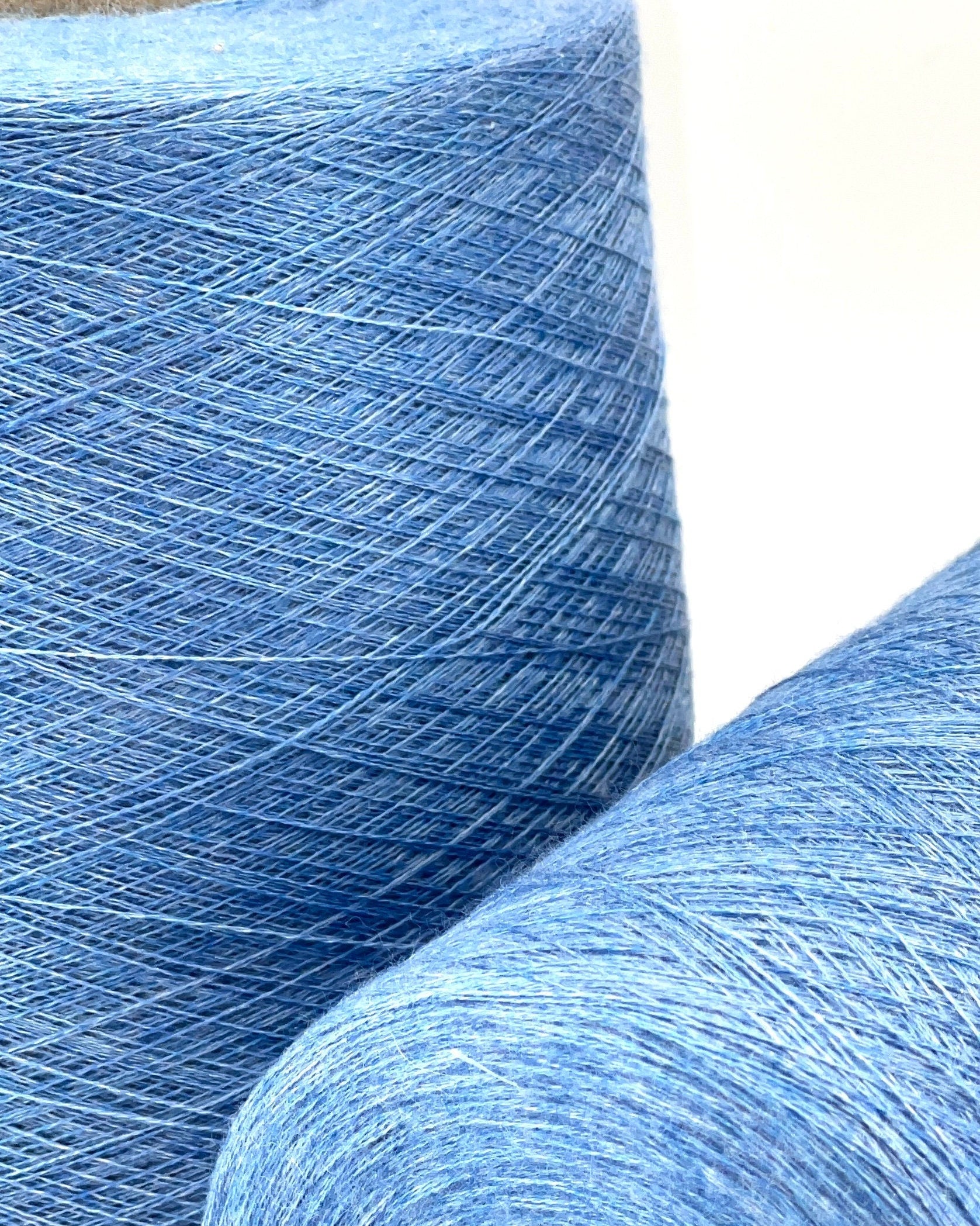 ROYAL 2/58 cashmere silk yarn luxury Italian lace yarn
70 cashmere 30 silk extra fine yarn 2900m per 100g
Luxury cashmere silk cone yarn for multi strand knitting and weaving
Light royal blue Italian yarn close up texture detail
ROYAL 2/58 lace yarn for couture knitting and blending