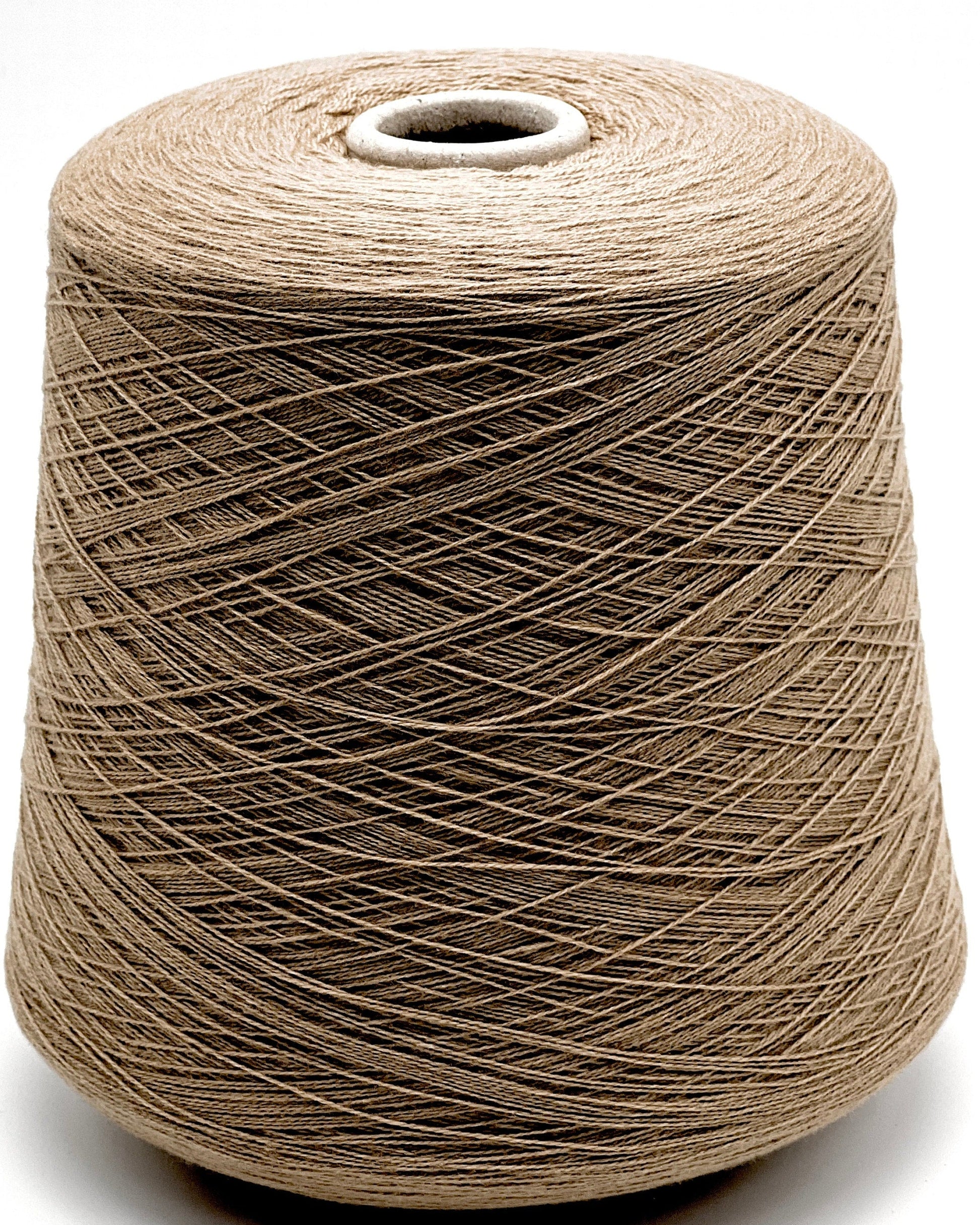 Spool of brown thread on a white background