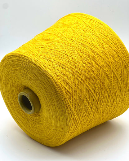 Yellow spool of yarn on a white background