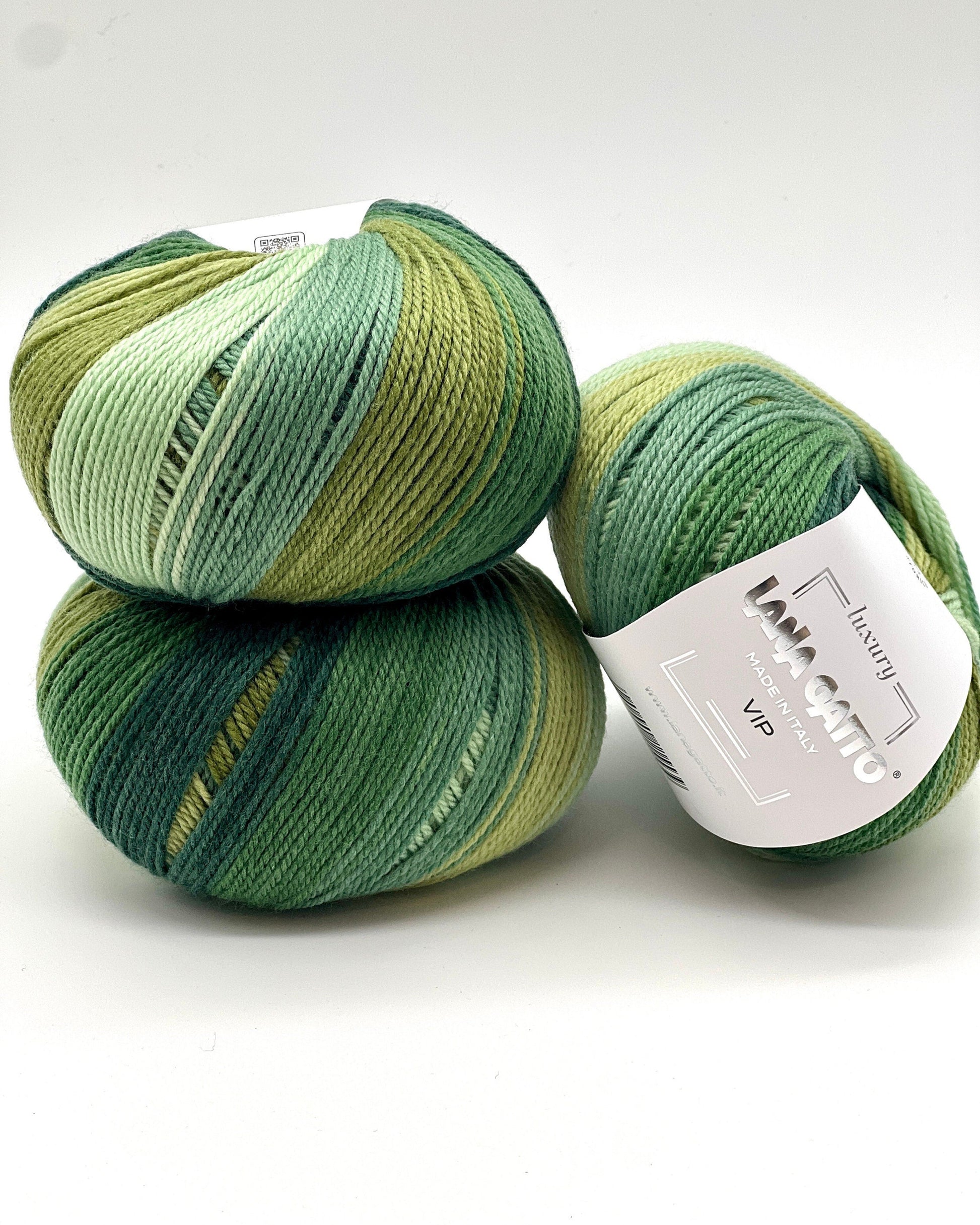 Three skeins of green yarn stacked on a white background with 'Lana Grossa' label.