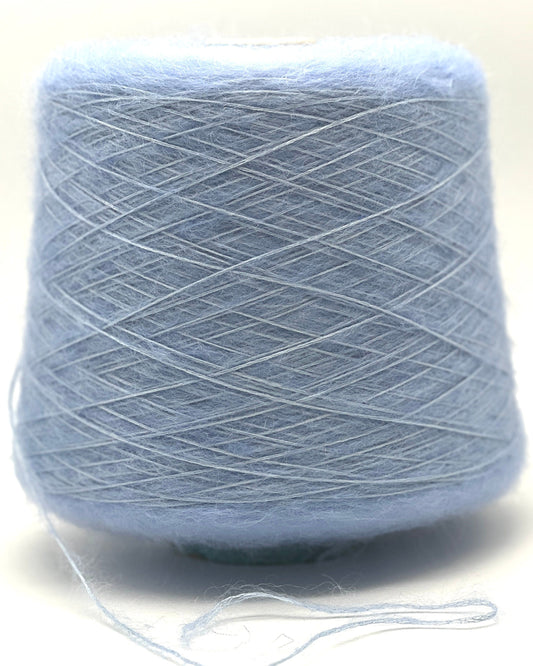 Light blue skein of yarn on a white background