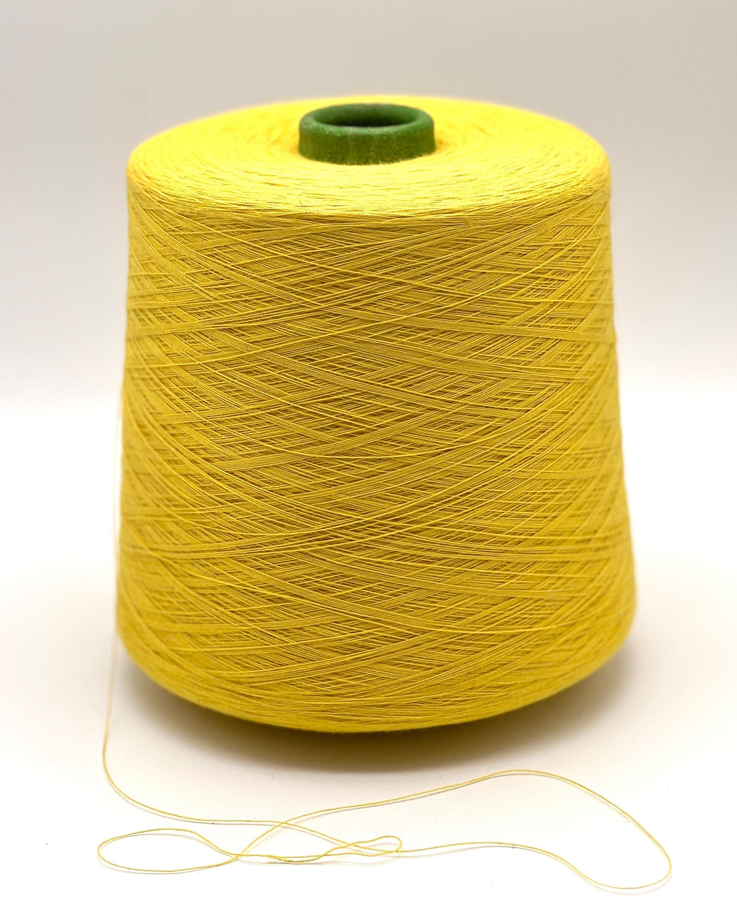 YUMA by Prisma Ricerche — sunflower yellow ecological lace-weight cable cotton yarn, shown on cone and in texture close-ups, available at iDOKNiT.