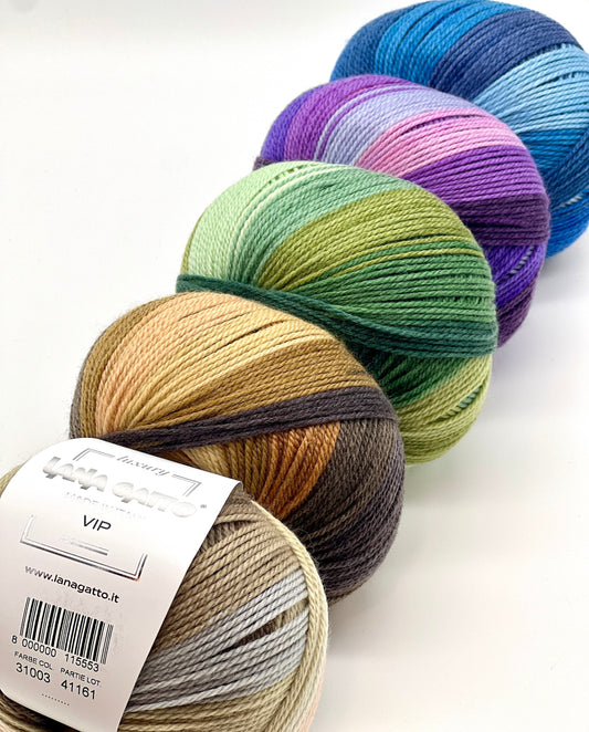 Colorful yarn balls on a white background