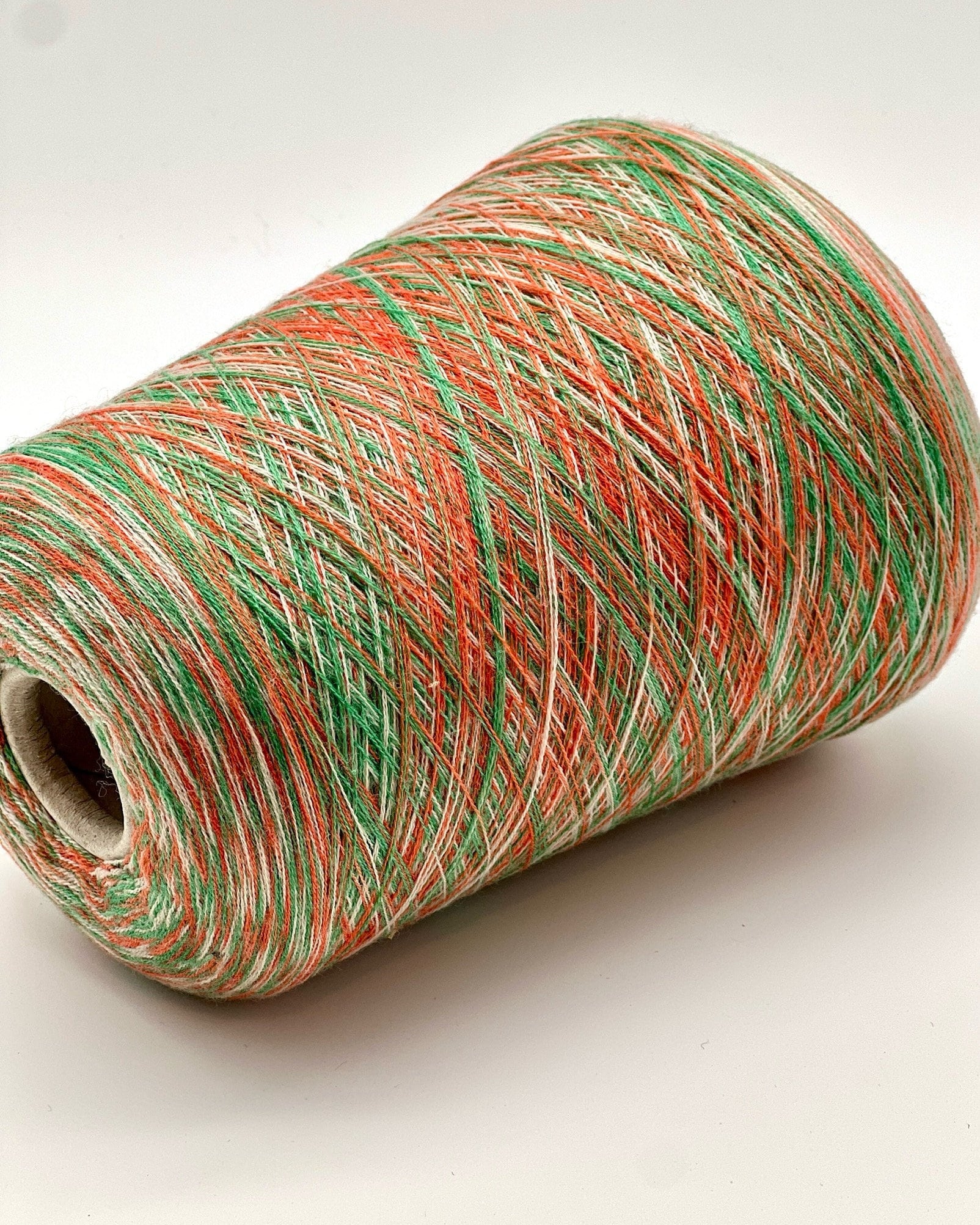 Rare MISSONI 100% Merino super fine yarn on cones. Features vibrant multicolor mixes like Violet Pink (806) and Green Orange (807). Premium Italian designer yarn available at iDOKNiT.com.