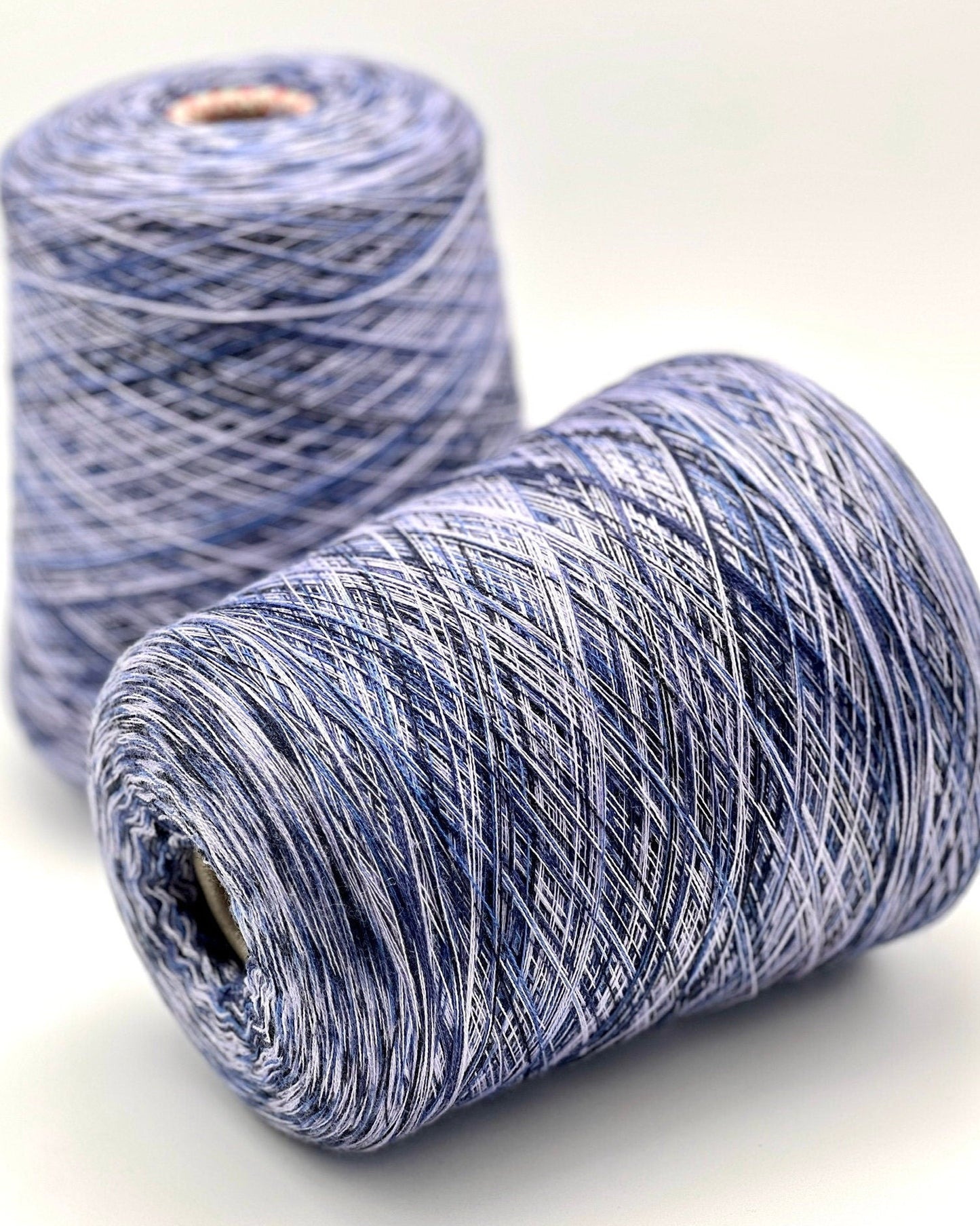 Rare MISSONI 100% Merino super fine yarn on cones. Features vibrant multicolor mixes like Violet Pink (806) and Green Orange (807). Premium Italian designer yarn available at iDOKNiT.com.