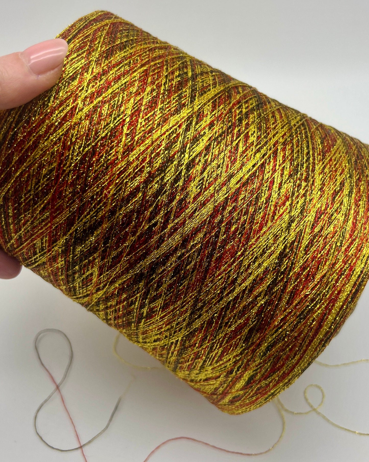 MISSONI DOMASO metallic lurex yarn cone in bright copper orange color, luxury Italian fashion-house yarn