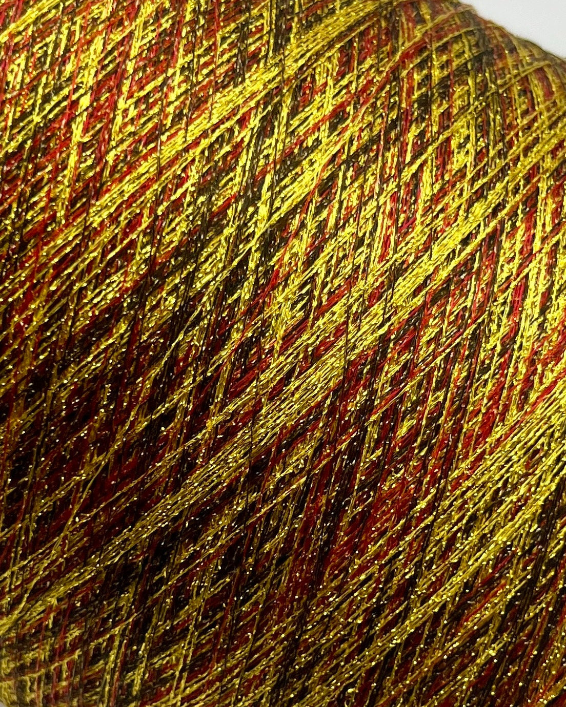 MISSONI DOMASO metallic lurex yarn cone in bright copper orange color, luxury Italian fashion-house yarn