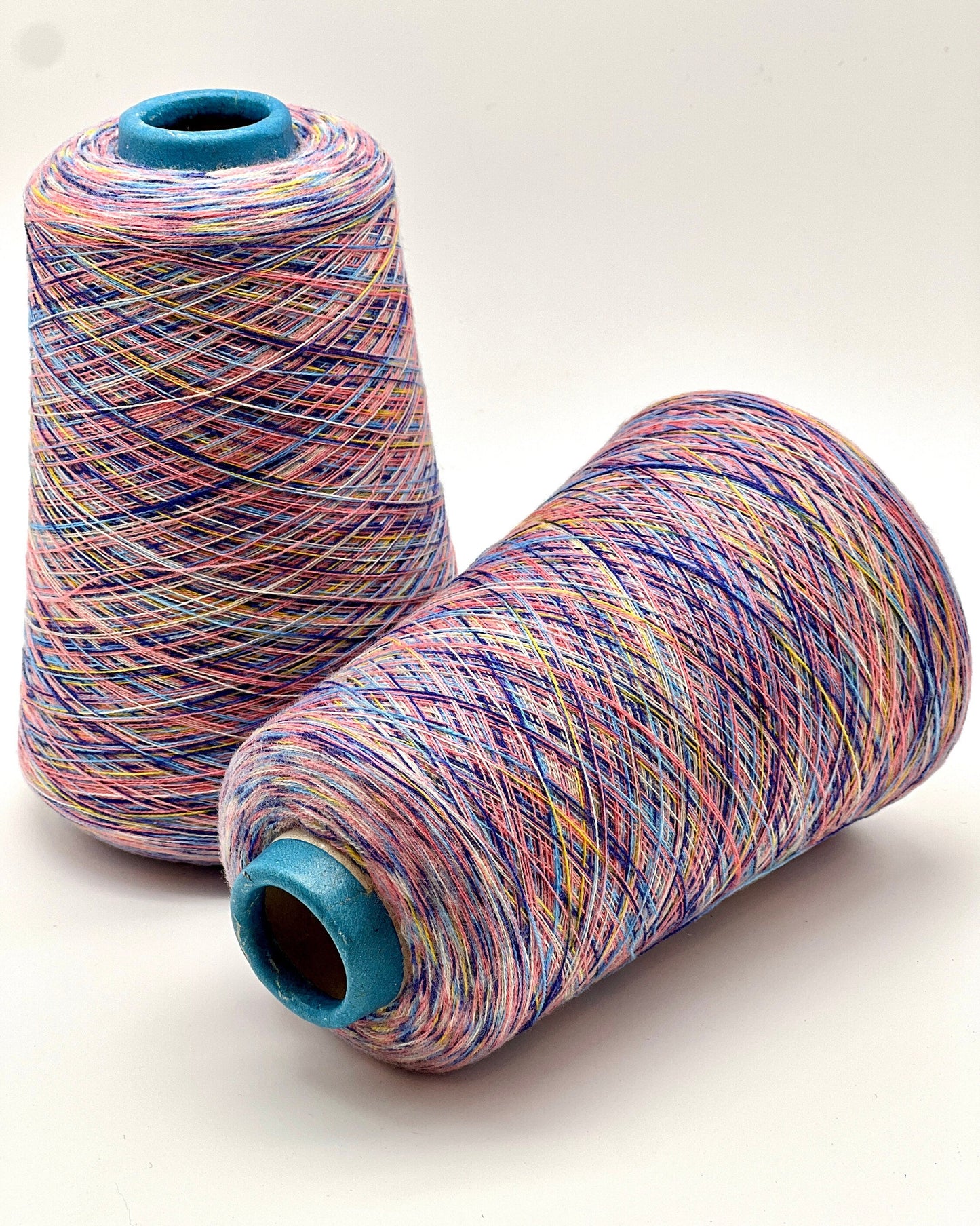 Rare MISSONI 100% Merino super fine yarn on cones. Features vibrant multicolor mixes like Violet Pink (806) and Green Orange (807). Premium Italian designer yarn available at iDOKNiT.com.