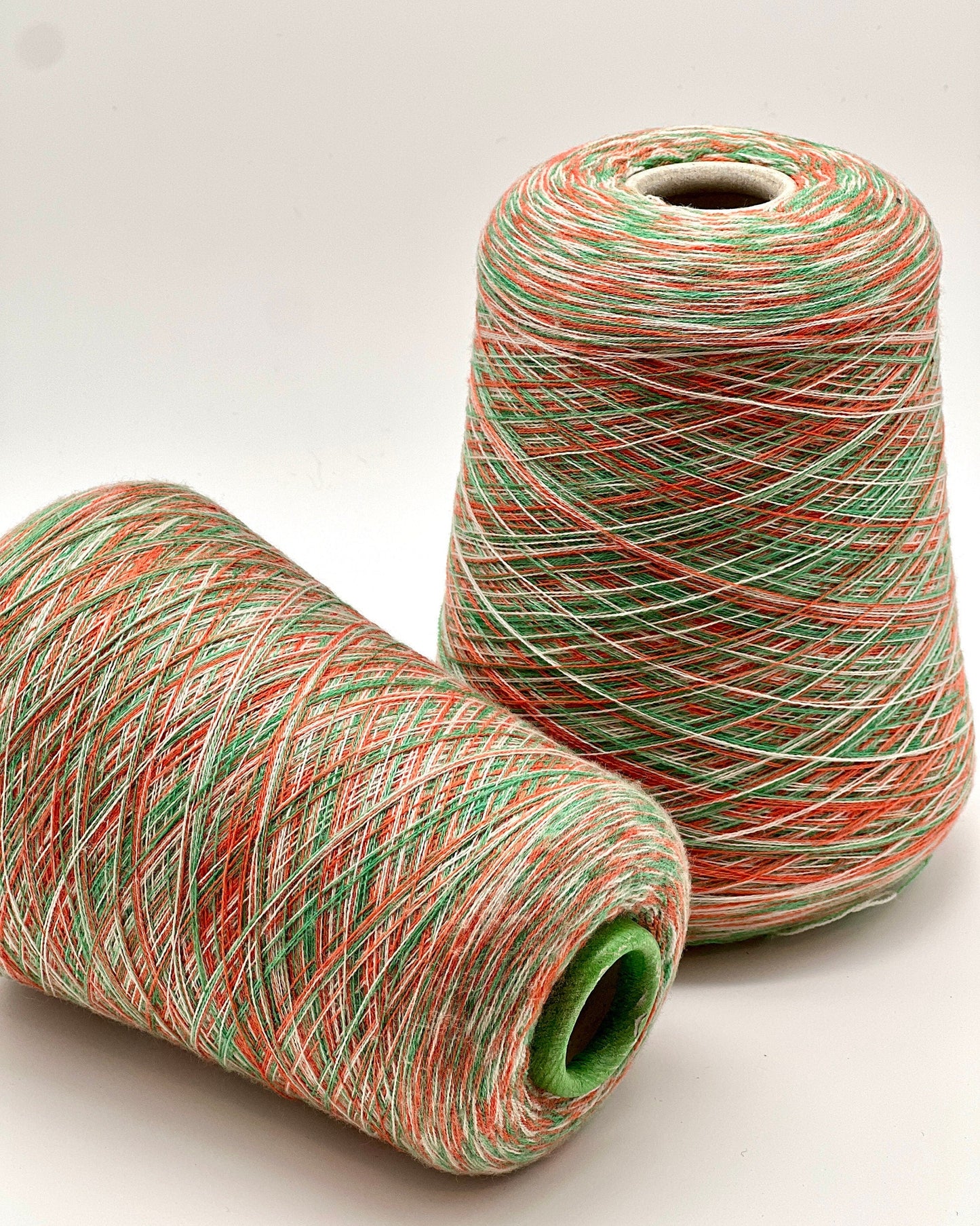 Rare MISSONI 100% Merino super fine yarn on cones. Features vibrant multicolor mixes like Violet Pink (806) and Green Orange (807). Premium Italian designer yarn available at iDOKNiT.com.