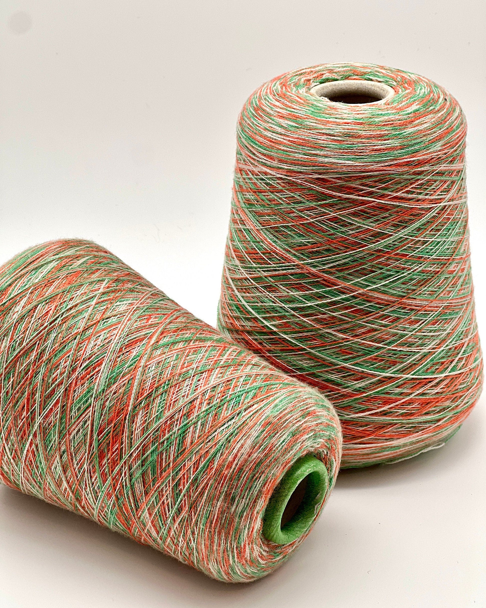 Rare MISSONI 100% Merino super fine yarn on cones. Features vibrant multicolor mixes like Violet Pink (806) and Green Orange (807). Premium Italian designer yarn available at iDOKNiT.com.