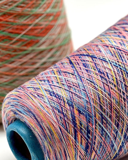 Rare MISSONI 100% Merino super fine yarn on cones. Features vibrant multicolor mixes like Violet Pink (806) and Green Orange (807). Premium Italian designer yarn available at iDOKNiT.com.