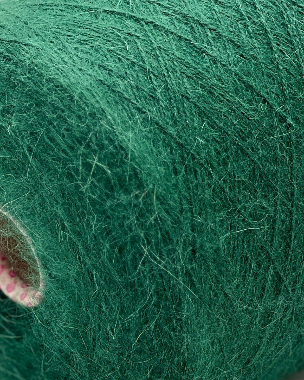 Close-up of green yarn on a white background