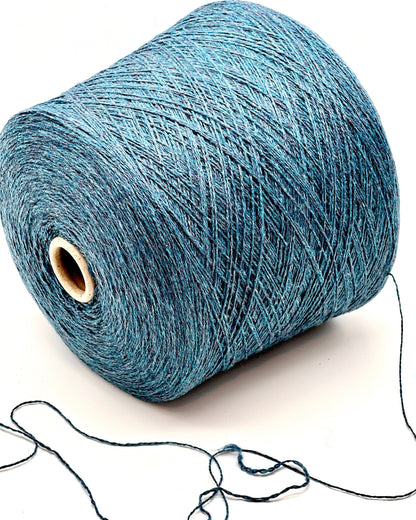 Blue yarn spool on a white background