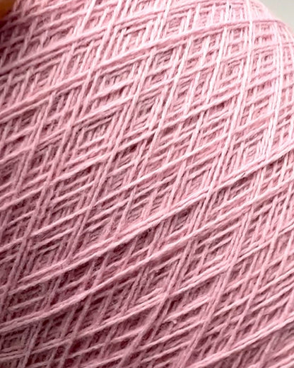 Close-up of pink yarn with a textured pattern