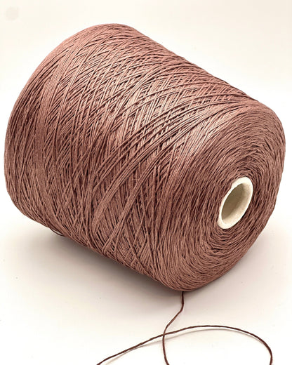 Brown spool of yarn on a white background