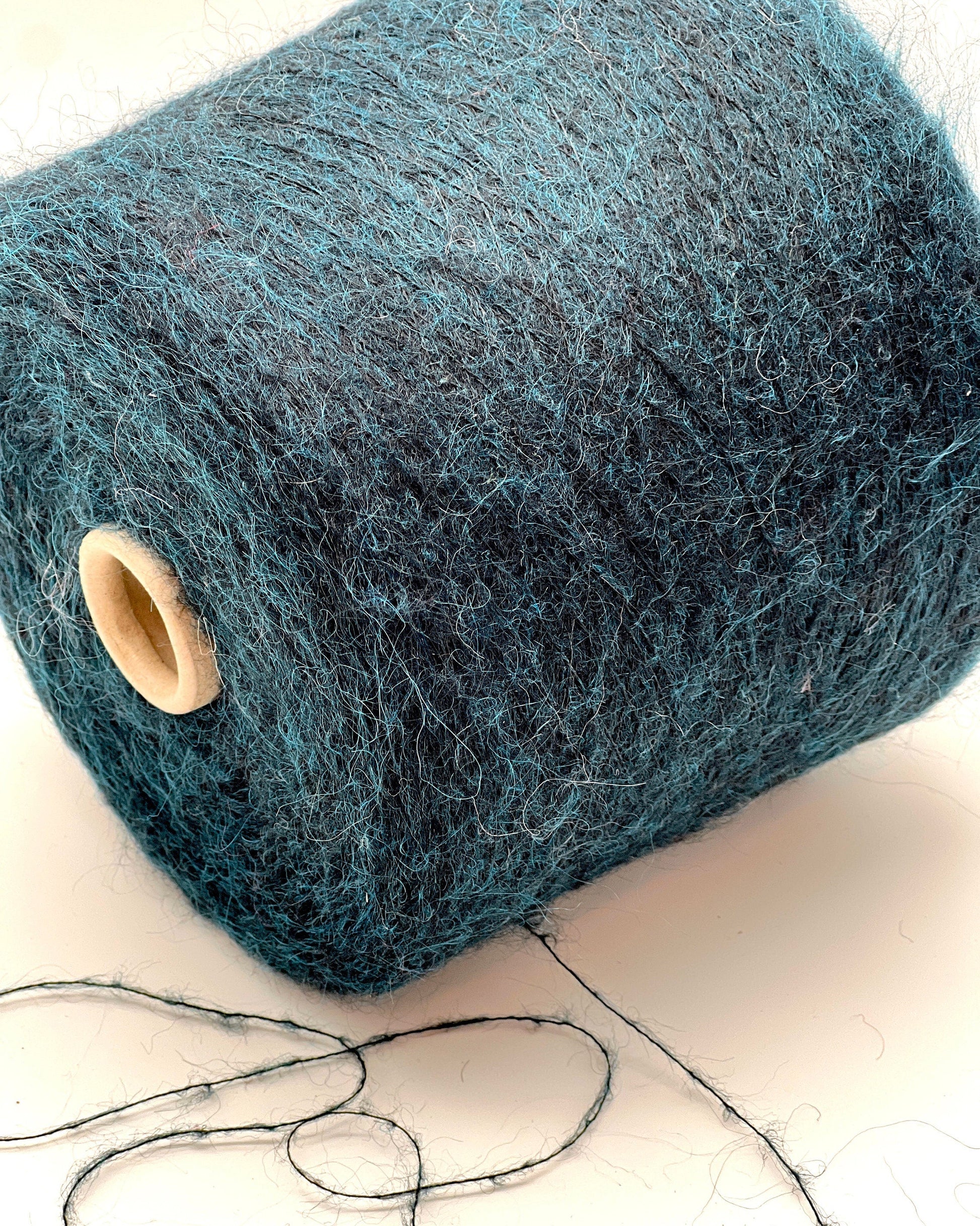 Exclusive iDOKNiT extra fine lace weight yarn, ASTRO by IGEA Italy. A luxury cloud-like blend of 67% superkid mohair, 30% polyamide, and 3% extra fine merino wool providing 1000m per 100g. Authentic Italian-made premium fiber curated by iDOKNiT for airy, delicate lace knitting, lightweight garments, and elegant multi-strand fiber blending.