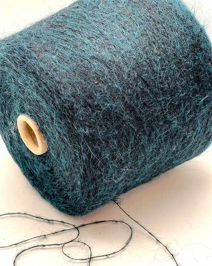 Exclusive iDOKNiT extra fine lace weight yarn, ASTRO by IGEA Italy. A luxury cloud-like blend of 67% superkid mohair, 30% polyamide, and 3% extra fine merino wool providing 1000m per 100g. Authentic Italian-made premium fiber curated by iDOKNiT for airy, delicate lace knitting, lightweight garments, and elegant multi-strand fiber blending.