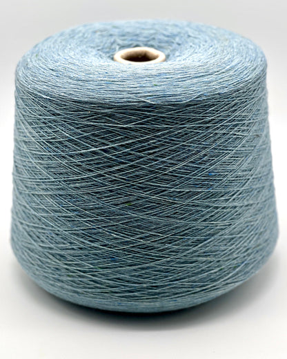 Blue spool of yarn on a white background