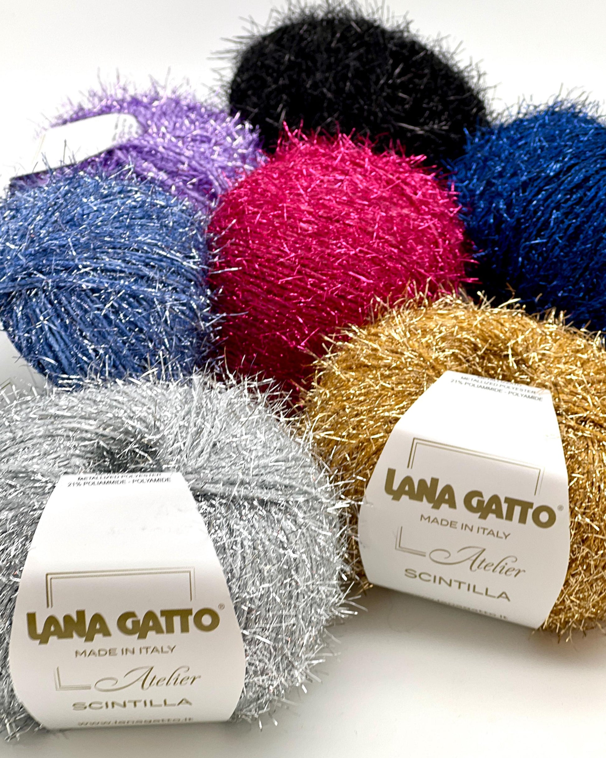 Colorful yarn balls with 'Lana Gatto' labels on a white background