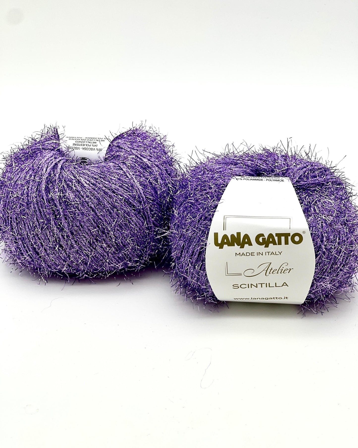 Two balls of purple yarn with a Lana Gatto label on a white background