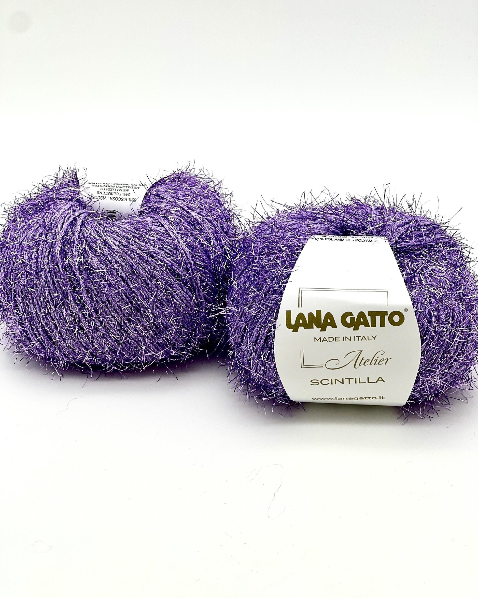 Two balls of purple yarn with a Lana Gatto label on a white background