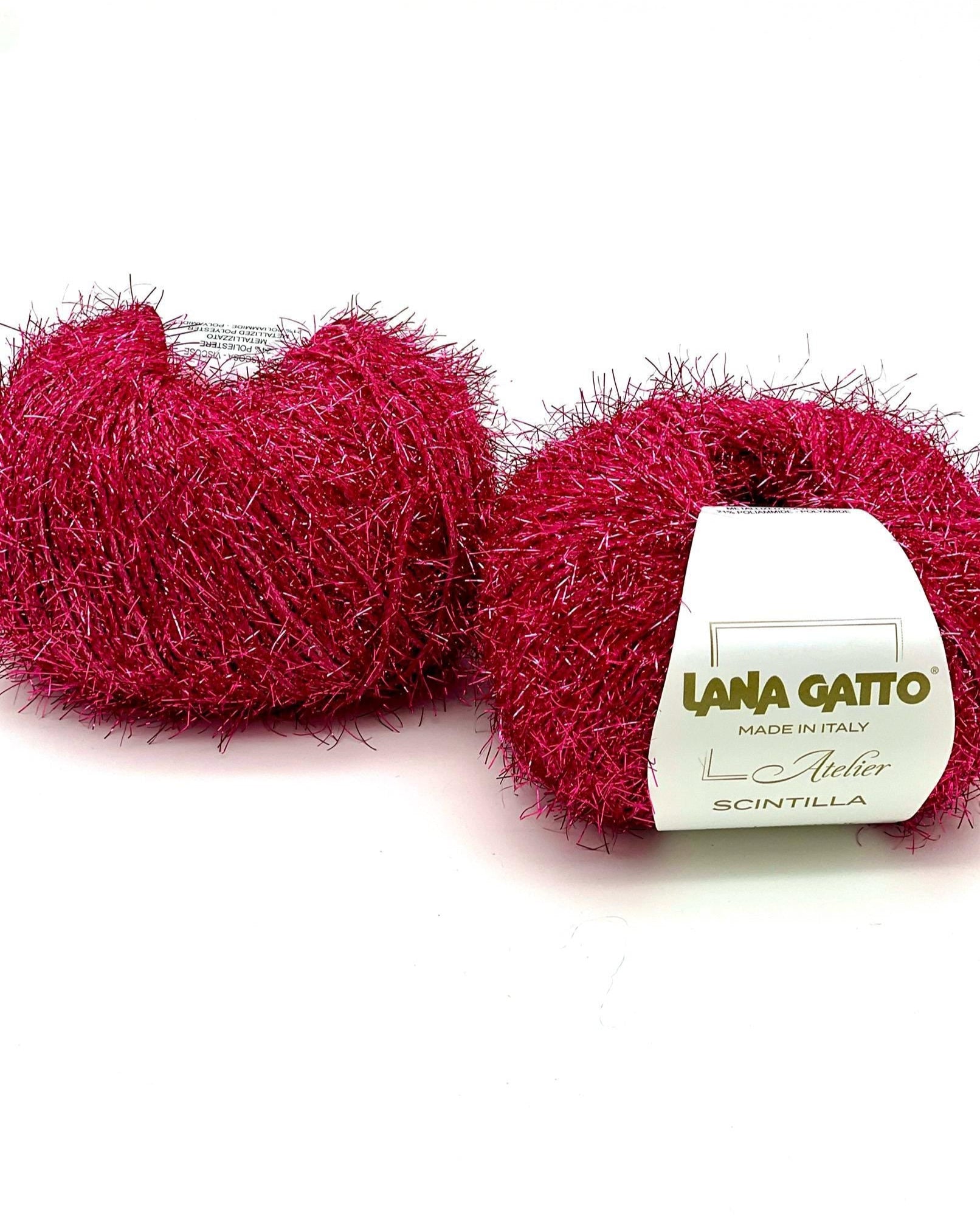 Two balls of red yarn with a 'Lana Gatto' label on a white background