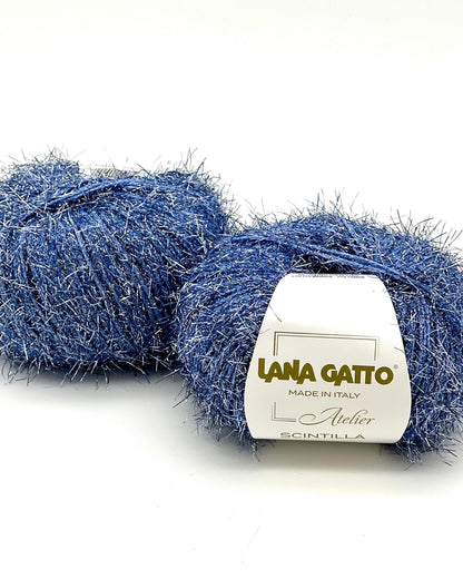 Two balls of blue yarn with a Lana Gatto label on a white background