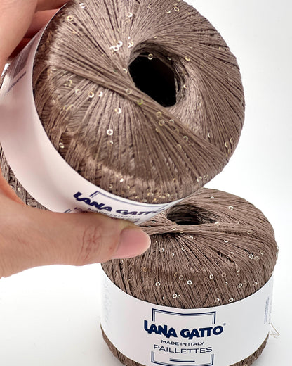 Lana Gatto Paillettes yarn in shimmering pastel tones, with delicate 2mm sequins, lightweight polyester yarn ideal for adding sparkle to knit or crochet projects. Made in Italy. 30100 Camel color.