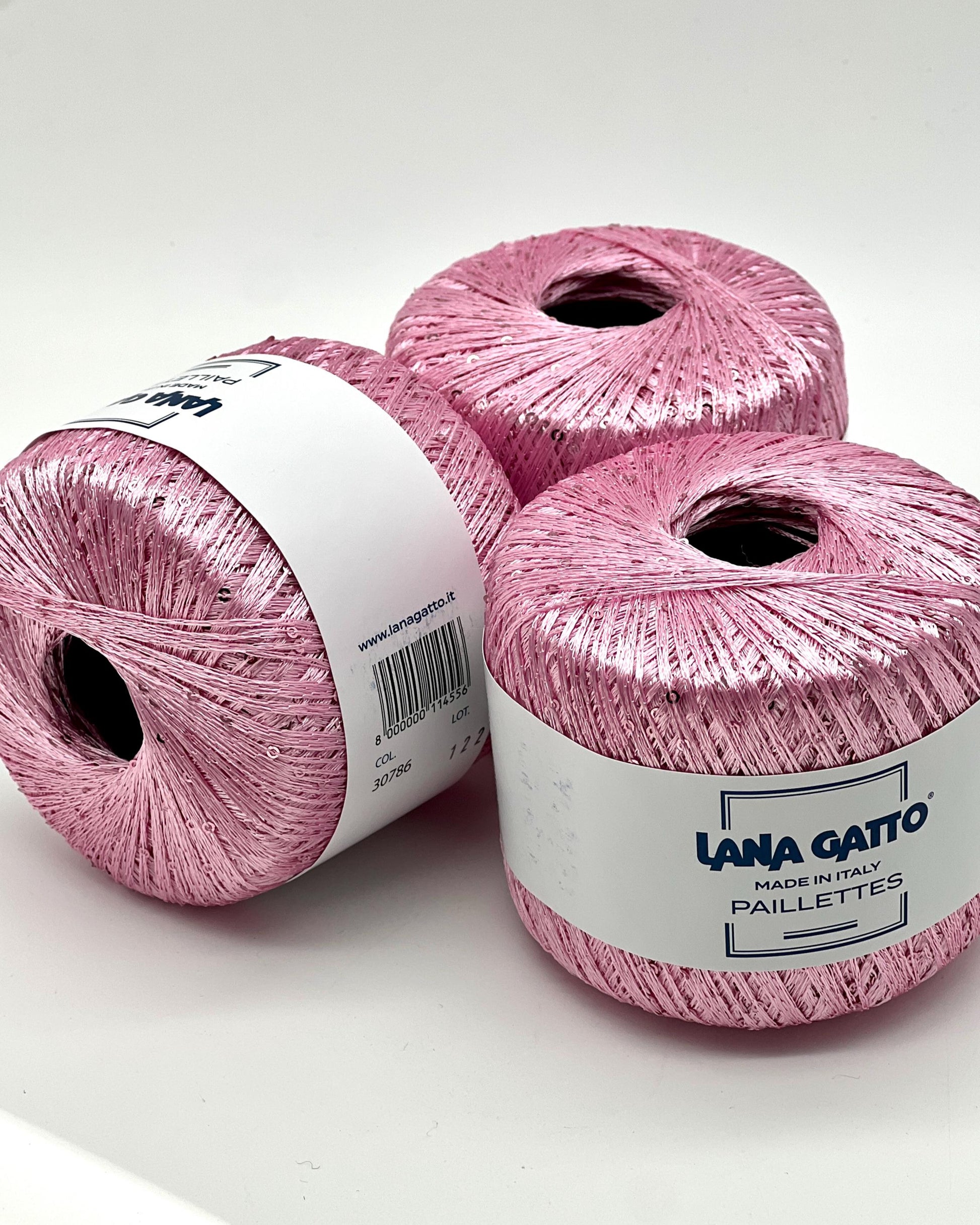 Lana Gatto Paillettes yarn in shimmering pastel tones, with delicate 2mm sequins, lightweight polyester yarn ideal for adding sparkle to knit or crochet projects. Made in Italy. 30786 candy pink color.