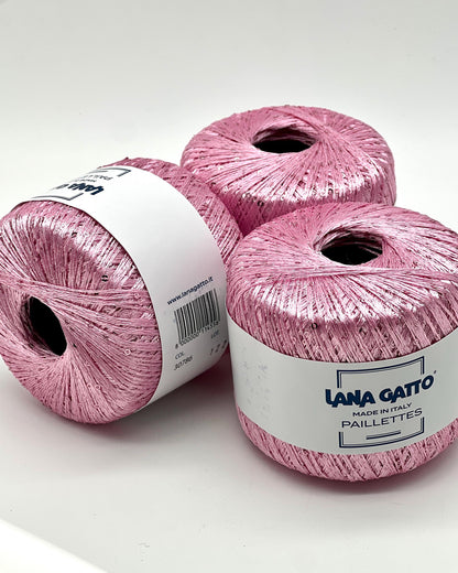 Lana Gatto Paillettes yarn in shimmering pastel tones, with delicate 2mm sequins, lightweight polyester yarn ideal for adding sparkle to knit or crochet projects. Made in Italy. 30786 candy pink color.