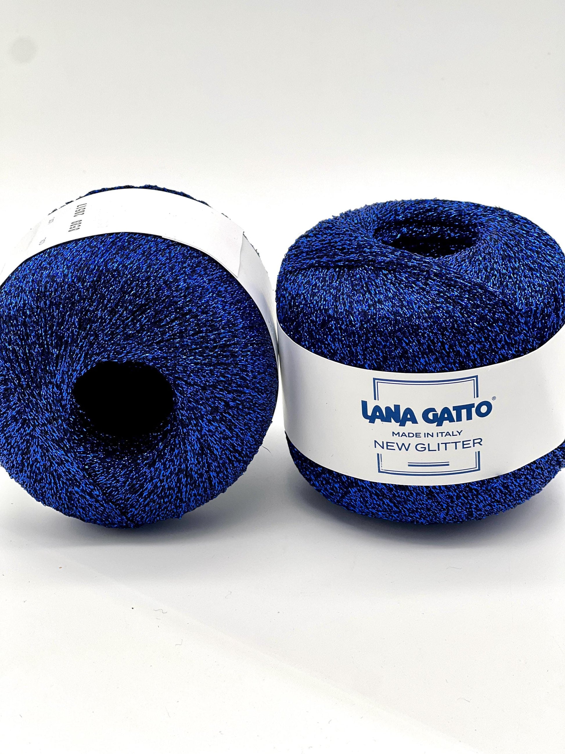 Two balls of blue yarn with a label on a white background