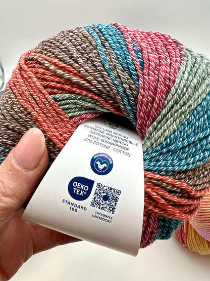 Exclusive iDOKNiT sport weight yarn, Gradient MERINOCOT by Lana Gatto Italy. A premium Italian-made blend of 53% merino wool and 47% cotton featuring a smooth gradient color transition. Providing 125m per 50g ball, this luxury fiber is curated by iDOKNiT for breathable, soft, and artistic garments with natural depth across all seasons.