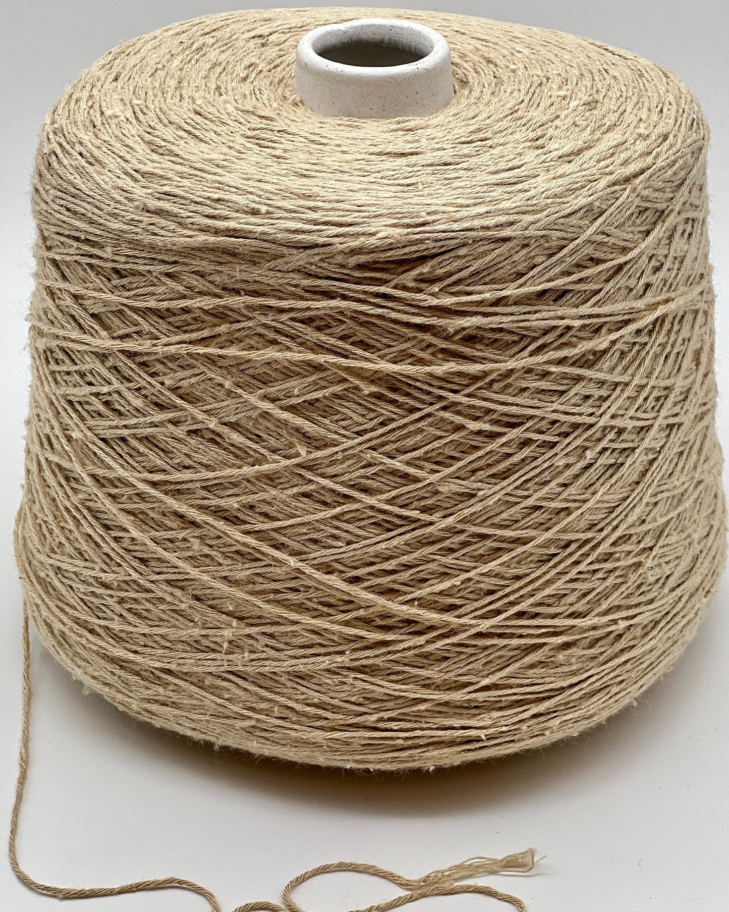 Exclusive iDOKNiT sport weight yarn, SETA TUSSAH by RiGo Italy. 100% pure Tussah silk with a Tit. 3000 count, providing 300m per 100g. Authentic Italian-made luxury fiber featuring a soft, slightly textured matte sheen, curated by iDOKNiT for elegant hand and machine knitting projects.