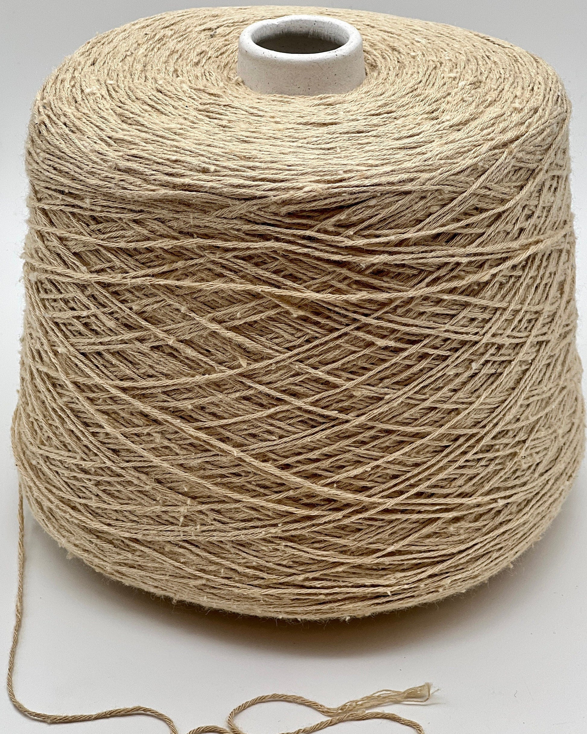 Exclusive iDOKNiT sport weight yarn, SETA TUSSAH by RiGo Italy. 100% pure Tussah silk with a Tit. 3000 count, providing 300m per 100g. Authentic Italian-made luxury fiber featuring a soft, slightly textured matte sheen, curated by iDOKNiT for elegant hand and machine knitting projects.