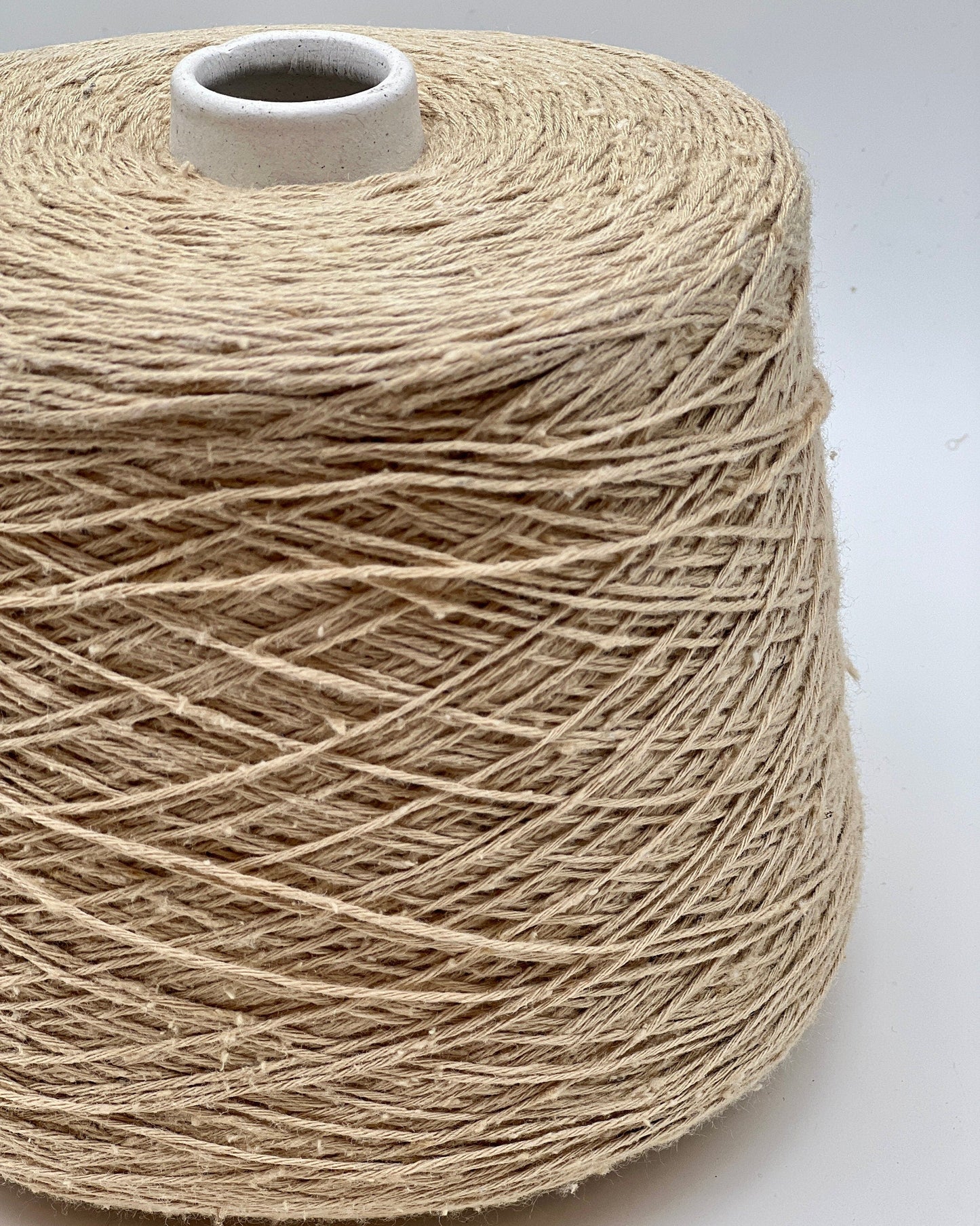 Exclusive iDOKNiT sport weight yarn, SETA TUSSAH by RiGo Italy. 100% pure Tussah silk with a Tit. 3000 count, providing 300m per 100g. Authentic Italian-made luxury fiber featuring a soft, slightly textured matte sheen, curated by iDOKNiT for elegant hand and machine knitting projects.