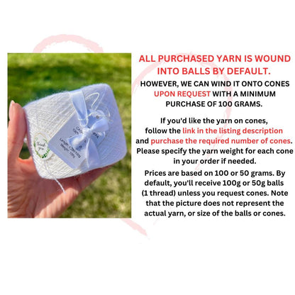 White yarn ball with a blue bow held in a hand against a grassy background, accompanied by text about yarn availability.