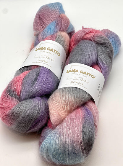 Two skeins of multicolored yarn with 'Lana Gatto' labels on a white background
