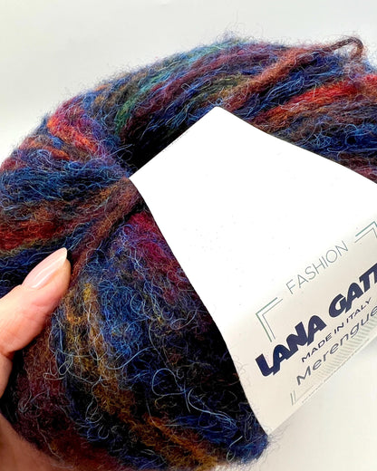 Multicolored yarn ball with a Lana Grossa label on a white background