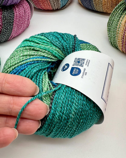 Exclusive iDOKNiT sport weight yarn, Gradient MERINOCOT by Lana Gatto Italy. A premium Italian-made blend of 53% merino wool and 47% cotton featuring a smooth gradient color transition. Providing 125m per 50g ball, this luxury fiber is curated by iDOKNiT for breathable, soft, and artistic garments with natural depth across all seasons.