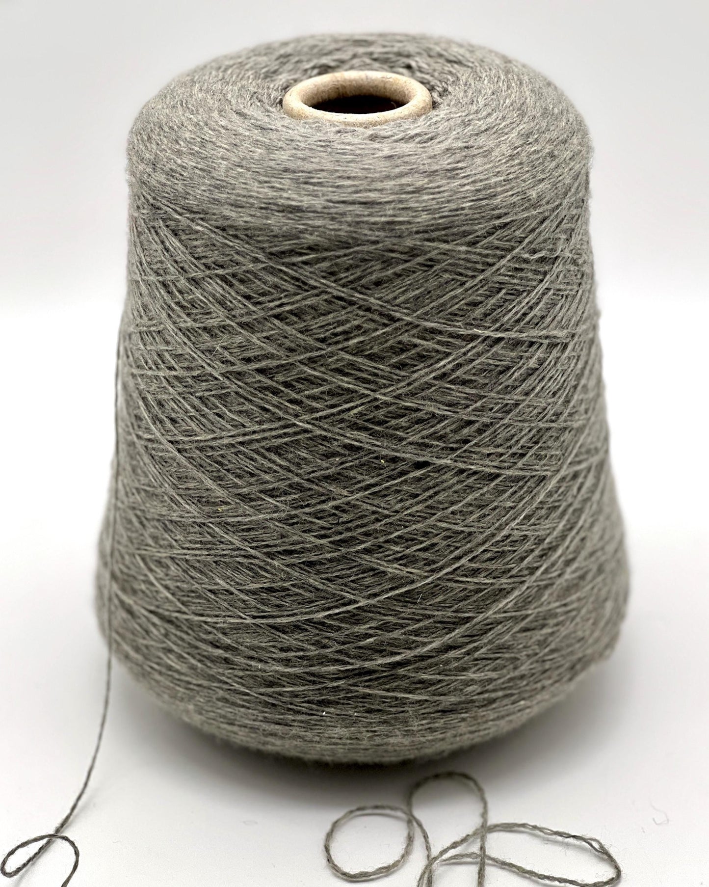 Luxury Italian cashmere yarn CASH LIGHT FINE 850m
100 percent cashmere lace light fingering yarn cone Italy
soft Italian cashmere yarn for sweaters shawls and scarves
premium cashmere yarn close up texture detail
luxury knitting weaving crochet cashmere yarn cone