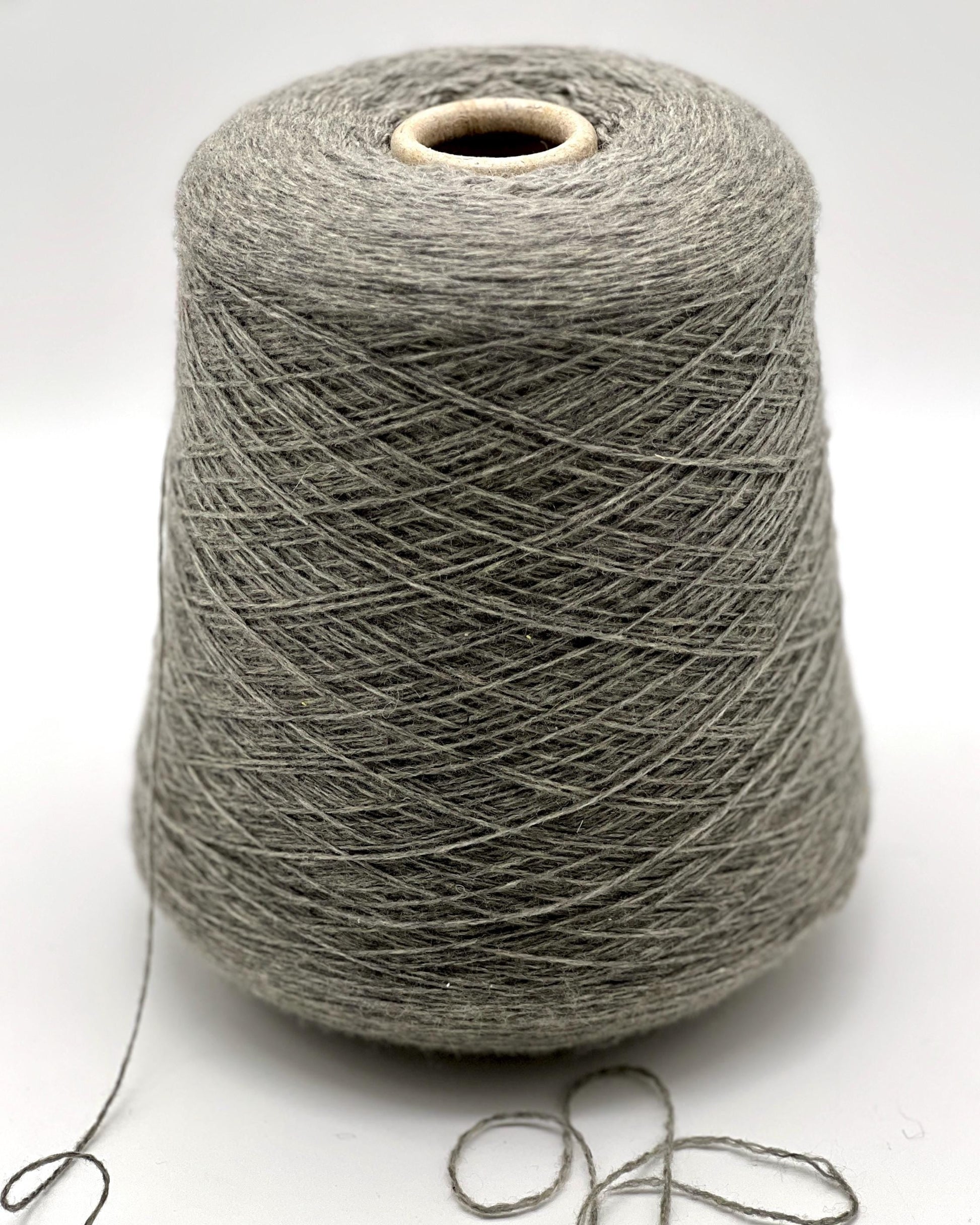 Luxury Italian cashmere yarn CASH LIGHT FINE 850m
100 percent cashmere lace light fingering yarn cone Italy
soft Italian cashmere yarn for sweaters shawls and scarves
premium cashmere yarn close up texture detail
luxury knitting weaving crochet cashmere yarn cone