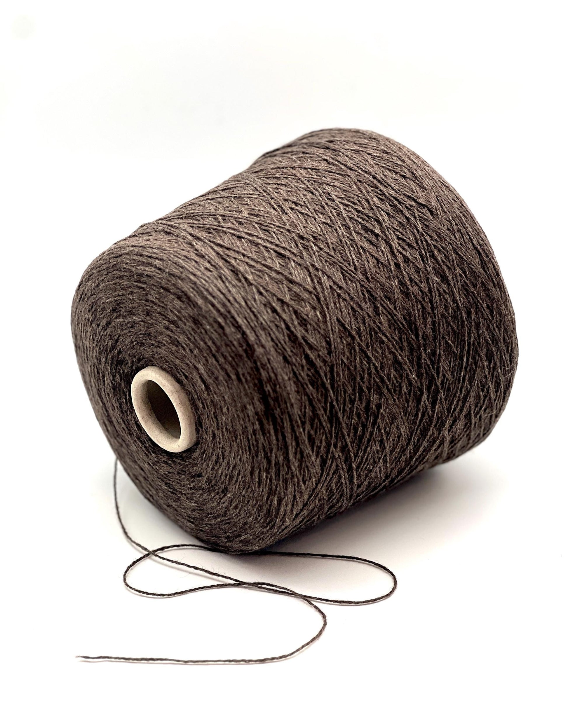 Brown yarn cone on a white background