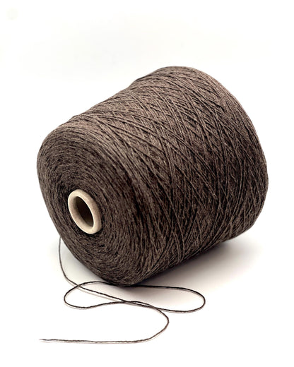 Brown yarn cone on a white background