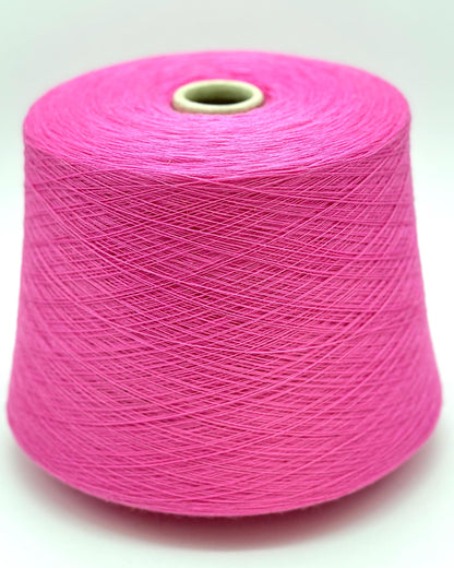 Pink spool of yarn on a white background