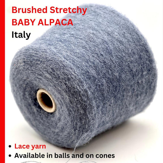 Spool of brushed stretchy baby alpaca yarn with text on a white background