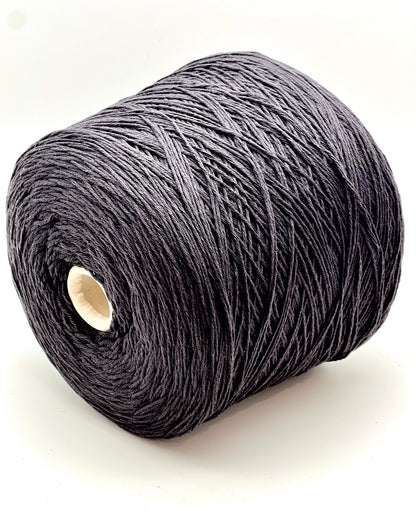 A curated collection of RiGo Supergeelong premium merino wool yarn in a palette of sophisticated neutrals and soft pinks. The image highlights the smooth, even texture and excellent stitch definition of this 100% Italian-made DK/Sport weight fiber. Authentic luxury yarn available at iDOKNiT.com.